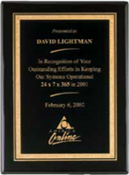 Black stained piano finish plaque with a black textured center plate and florentine border